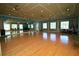 Large dance studio with hardwood floors and mirrors at 2298 Caledonian St, Clermont, FL 34711