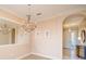 Elegant dining room with hardwood floors, a large chandelier, and mirror at 2298 Caledonian St, Clermont, FL 34711