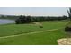 Scenic golf course view with lake in the background at 2298 Caledonian St, Clermont, FL 34711