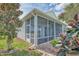 View of the house exterior, highlighting the screened porch at 2298 Caledonian St, Clermont, FL 34711