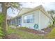 House exterior showcasing a screened patio and landscaping at 2298 Caledonian St, Clermont, FL 34711