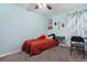 Light blue bedroom with a double bed and a small workspace at 2334 Bexley Dr, Tavares, FL 32778