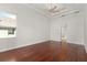 Bright bedroom featuring hardwood floors and natural light at 2441 Bar Harbor Bay, Mount Dora, FL 32757