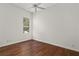 Bedroom with wood floors and a window with blinds at 2441 Bar Harbor Bay, Mount Dora, FL 32757