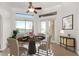 Breakfast nook with water views and a ceiling fan at 2441 Bar Harbor Bay, Mount Dora, FL 32757