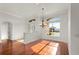 Bright dining room with hardwood floors and large windows at 2441 Bar Harbor Bay, Mount Dora, FL 32757