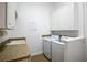 Laundry room with cabinets, washer, and dryer at 2441 Bar Harbor Bay, Mount Dora, FL 32757