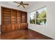 Spacious library with built-in wooden shelving at 2441 Bar Harbor Bay, Mount Dora, FL 32757