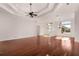 Sunlit living room with hardwood floors and entryway view at 2441 Bar Harbor Bay, Mount Dora, FL 32757