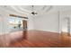 Living room with hardwood floors and sliding doors leading to patio at 2441 Bar Harbor Bay, Mount Dora, FL 32757