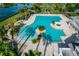 Aerial view of community pool area with spa and lounge chairs at 2441 Bar Harbor Bay, Mount Dora, FL 32757