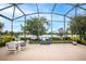 Spacious screened patio overlooking a lake at 2441 Bar Harbor Bay, Mount Dora, FL 32757