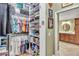 Walk-in closet with ample shelving and hanging space at 2532 Edenville Path, The Villages, FL 32162