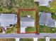 Property view outlined in red, highlighting its location and large lot size at 25941 Newcombe Cir, Leesburg, FL 34748