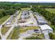 Aerial shot of a boat and trailer storage facility with organized rows and surrounded by green fields at 25941 Newcombe Cir, Leesburg, FL 34748