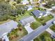 High-angle shot of a house with a long driveway, surrounded by lush greenery at 25941 Newcombe Cir, Leesburg, FL 34748