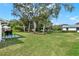 Wide backyard view, perfect for outdoor activities and relaxation at 25941 Newcombe Cir, Leesburg, FL 34748