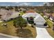 Aerial view of single Gathering home with driveway and landscaping at 26908 Honeymoon Ave, Leesburg, FL 34748