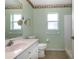 Guest bathroom with updated vanity, toilet and shower/tub combo at 26908 Honeymoon Ave, Leesburg, FL 34748