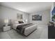 Main bedroom with plush bed and modern nightstands at 2725 Lakewood Ln, Eustis, FL 32726