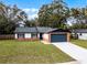 Updated single story home with a new garage door and landscaping at 2725 Lakewood Ln, Eustis, FL 32726