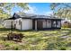 Side of house with screened porch and yard at 2725 Lakewood Ln, Eustis, FL 32726