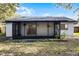 Back exterior view of house with screened porch at 2725 Lakewood Ln, Eustis, FL 32726