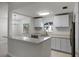 Modern kitchen featuring white cabinets and quartz countertops at 2725 Lakewood Ln, Eustis, FL 32726