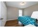 Bright bedroom with teal bedding and ample closet space at 27302 Orchid Glade St, Leesburg, FL 34748