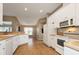 White kitchen with ample counter space and appliances at 27302 Orchid Glade St, Leesburg, FL 34748