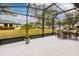 Large screened patio overlooking the backyard at 27302 Orchid Glade St, Leesburg, FL 34748