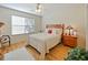 Cozy bedroom with light flooring and a window at 2762 Morven Park Way, The Villages, FL 32162