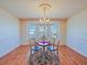 Dining room with hardwood floors and bay window at 2762 Morven Park Way, The Villages, FL 32162