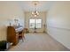 Bright dining room features a chandelier, window, and built-in desk at 2762 Morven Park Way, The Villages, FL 32162