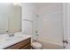 Clean bathroom with tub, vanity, and toilet at 2848 Supermarine Rd, Tavares, FL 32778