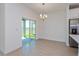 Bright dining area with sliding glass doors to backyard at 2848 Supermarine Rd, Tavares, FL 32778