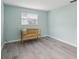 Empty bedroom with light walls and wood bench at 312 Brigadoon Cir # 312, Leesburg, FL 34788