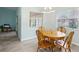 Dining area featuring wood table and chairs near kitchen at 312 Brigadoon Cir # 312, Leesburg, FL 34788