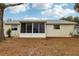 House exterior showcasing screened porch at 312 Brigadoon Cir # 312, Leesburg, FL 34788