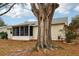 Rear exterior view of house with screened porch at 312 Brigadoon Cir # 312, Leesburg, FL 34788