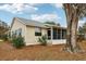 Exterior view of house with screened porch at 312 Brigadoon Cir # 312, Leesburg, FL 34788