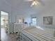 Bright bedroom with large bed and dresser at 3253 Archer Ave, The Villages, FL 32162