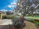 Landscaped patio with view of golf course at 3253 Archer Ave, The Villages, FL 32162