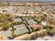 Aerial view of community tennis courts, pool, and clubhouse at 3488 Sterling St, The Villages, FL 32162