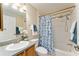 Bathroom with shower/tub combo, wood vanity, and updated fixtures at 3488 Sterling St, The Villages, FL 32162