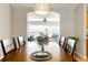 A closer view of the dining room, showcasing the table setting and natural light at 3488 Sterling St, The Villages, FL 32162