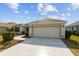 Single story house with attached garage and walkway leading to the entrance at 3488 Sterling St, The Villages, FL 32162