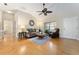 Living room with hardwood floors, couch, chair, and a coffee table at 3488 Sterling St, The Villages, FL 32162