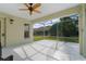 Screened patio with ceiling fan and view of backyard at 3488 Sterling St, The Villages, FL 32162