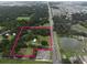 Aerial view showing property boundaries and surrounding environment at 3704 Warm Springs Ave, Wildwood, FL 34785